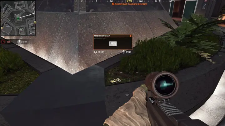 Keycard in the plants beside the glass pyramid
